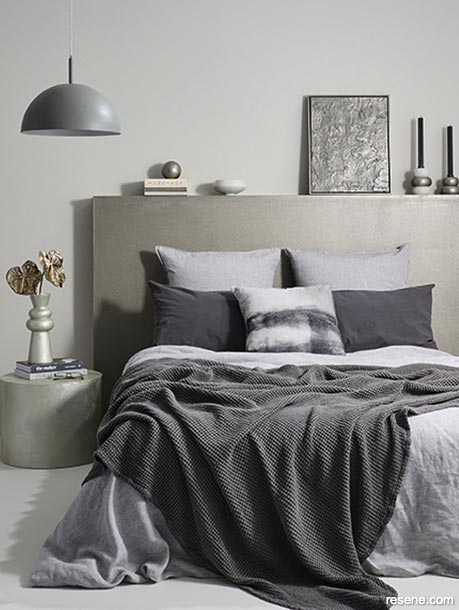 Luxe layering in soft pewter tones makes this bedroom a haven