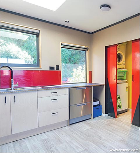 Bright kitchen with abstract black and red doors