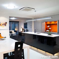 A sleek kitchen with vivid colour contrasts