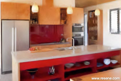 A red and beige kitchen