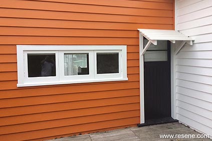Orange and black home entryway
