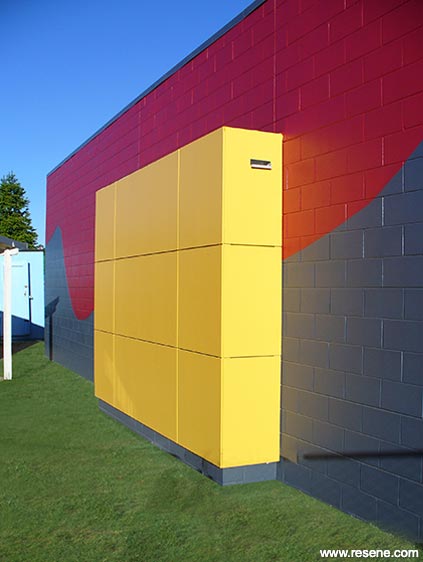 Yellow, red, and blue school exterior