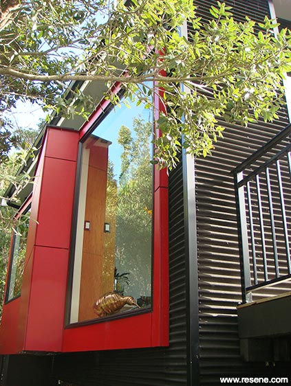 Red home exterior with corrugated sheets 