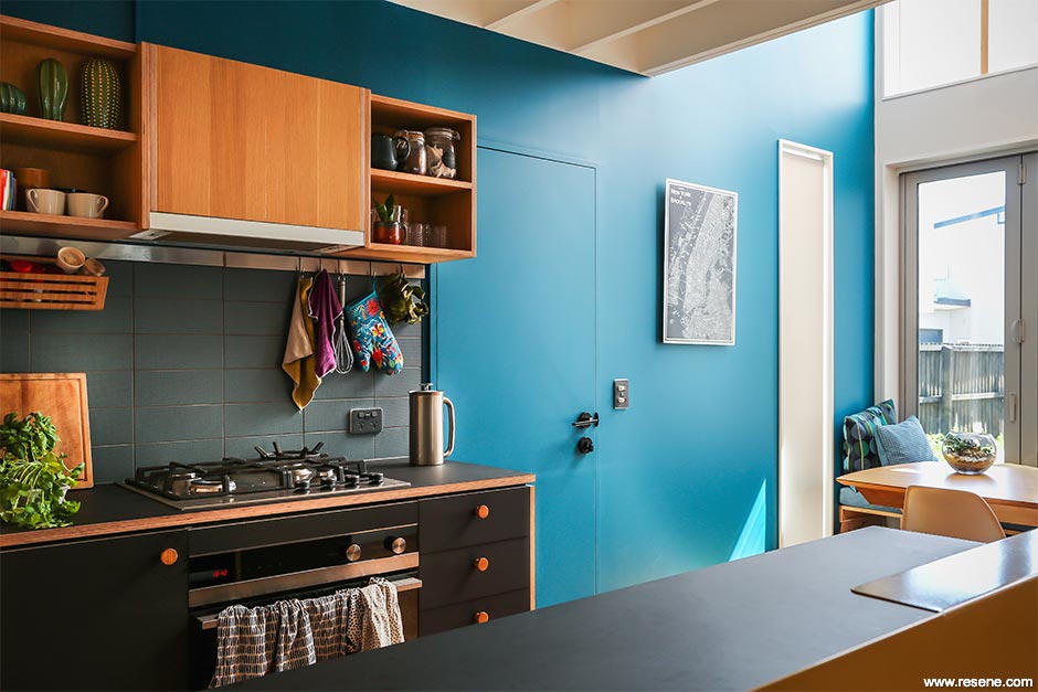 Dark blue and black kitchen