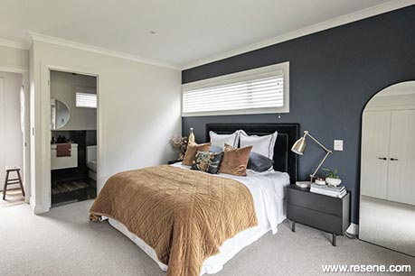 Dark blue and white guest room