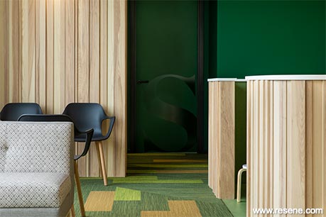 Green and wood reception desk