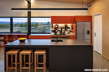 A modern red and black kitchen