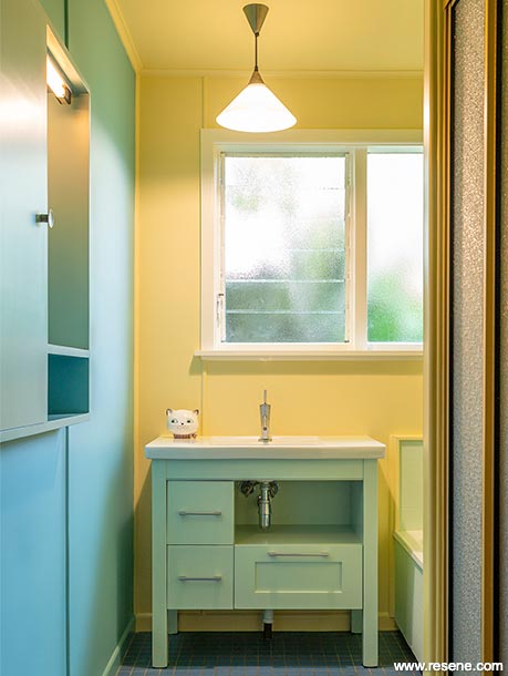 A blue and yellow bathroom