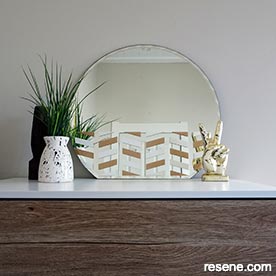 Paint a mirror with metallic paint for dramatic effect
