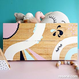 Paint a design on a wooden box