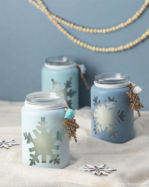 Paint snowflakes on your candle holders