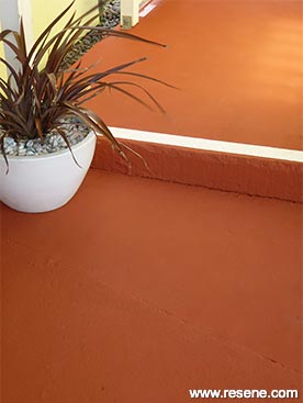 Create a terracota coloured path or patio