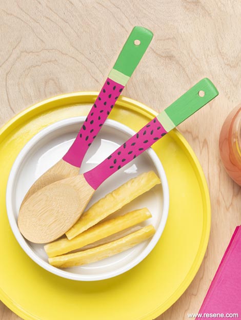 Paint wooden salad servers in a watermelon style
