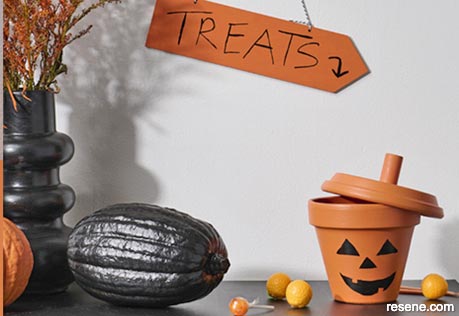 Turn a terracotta pot into a halloween painted treat pot